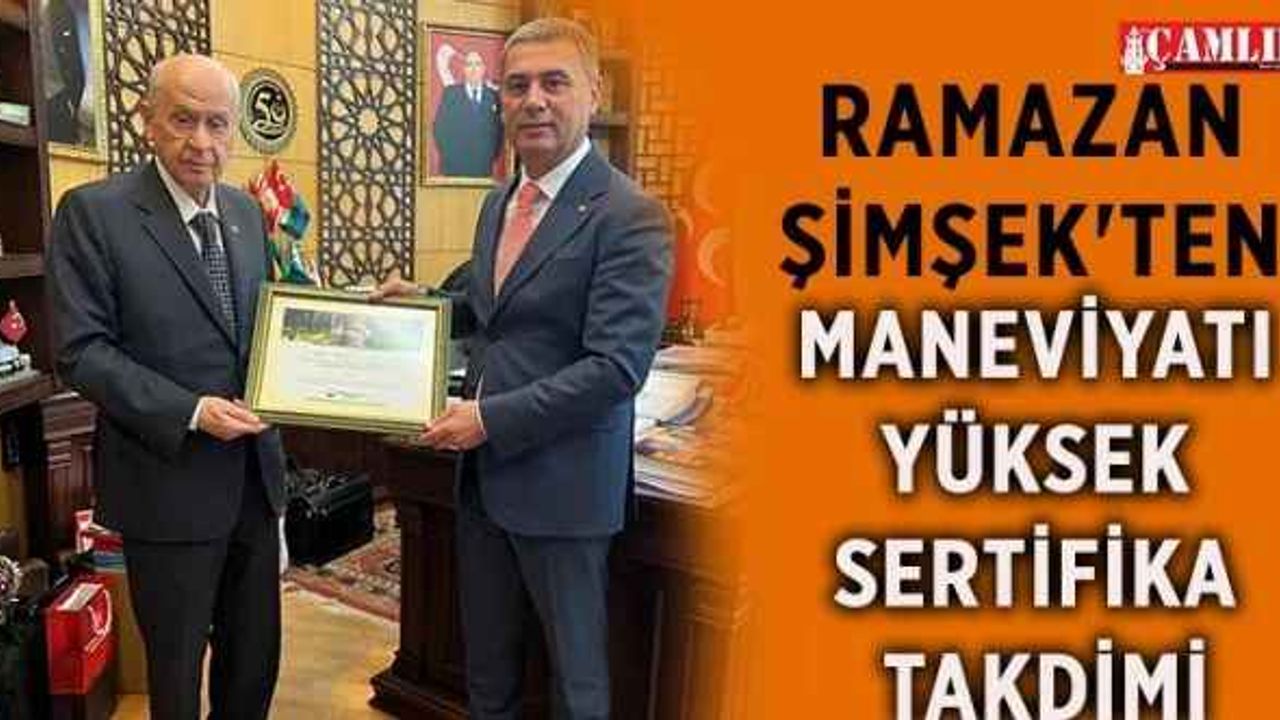 Gölbaşı Belediye Başkanı Ramazan Şimşek, MHP Genel Başkanı Devlet Bahçeli'nin babası adına dikilen fidanın sertifikasını kendisine takdim etti